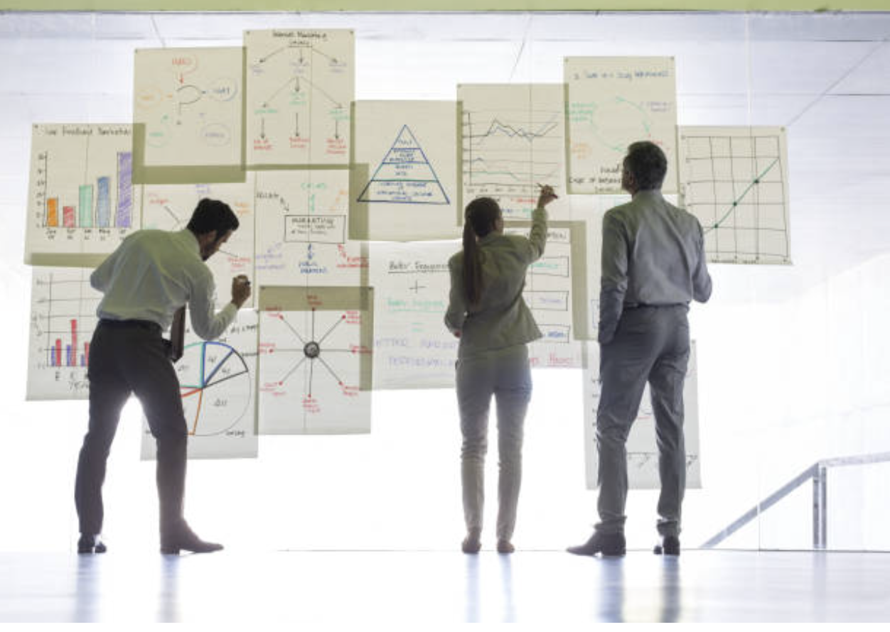 SAD employees working on system models