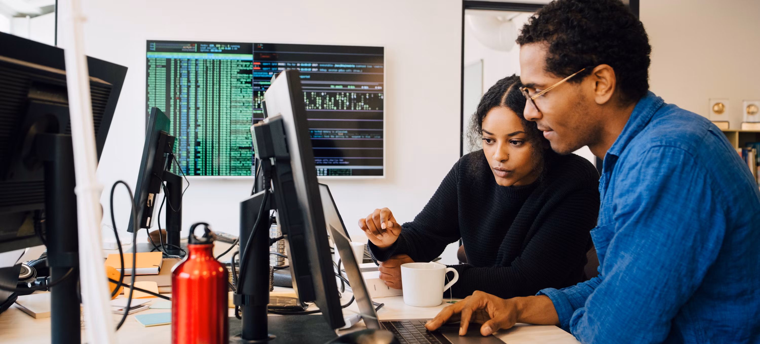 2 workers analyzing systems